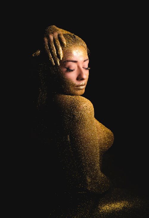 A Naked Woman Covered with Gold Glitters