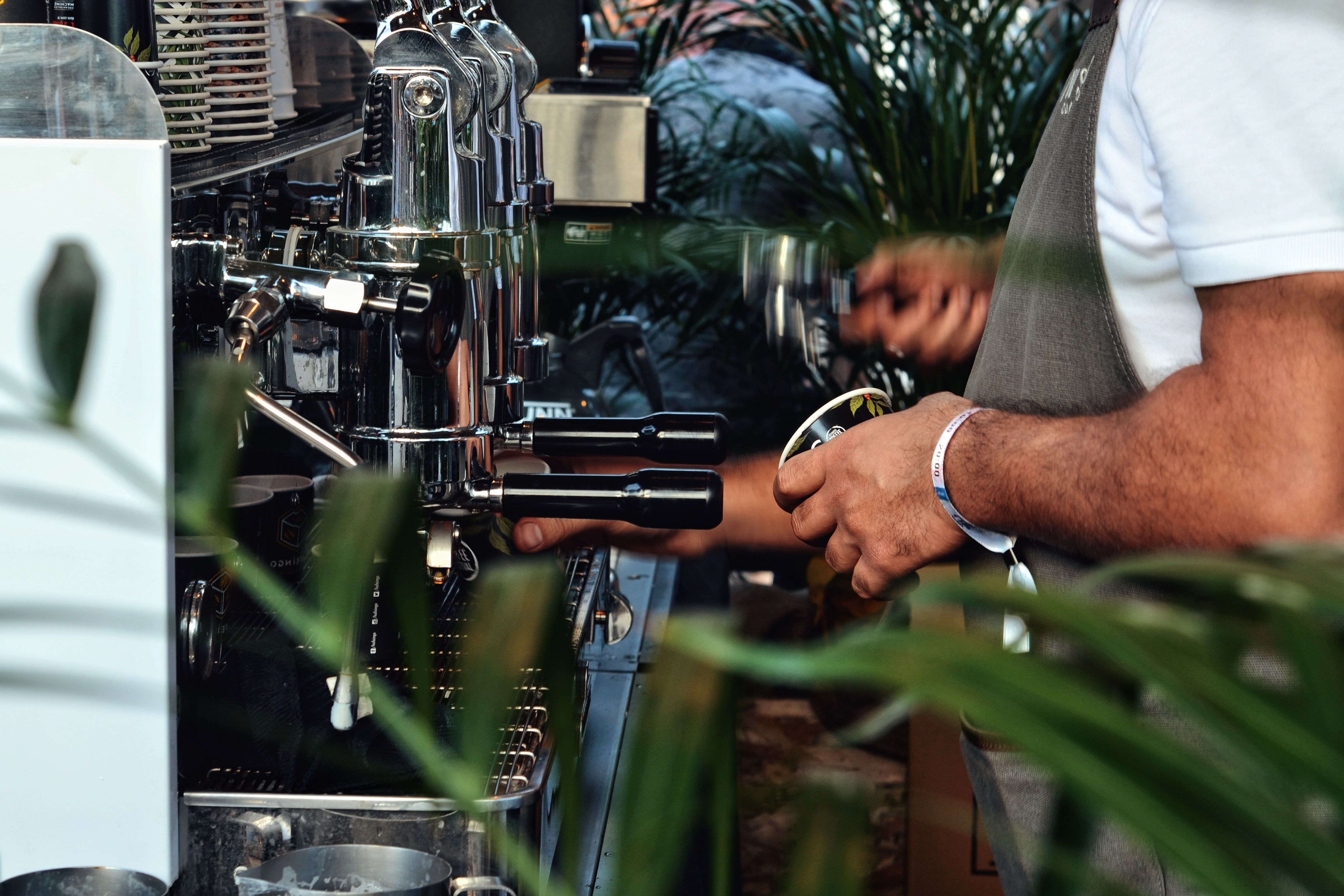 Close-up of a coffee machine in use, showing internal components