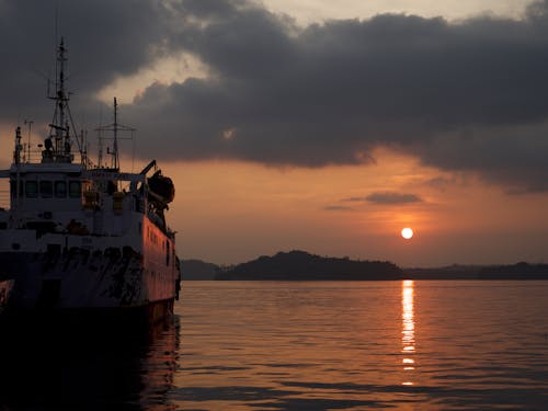 A Boat on the Sea during Sunset