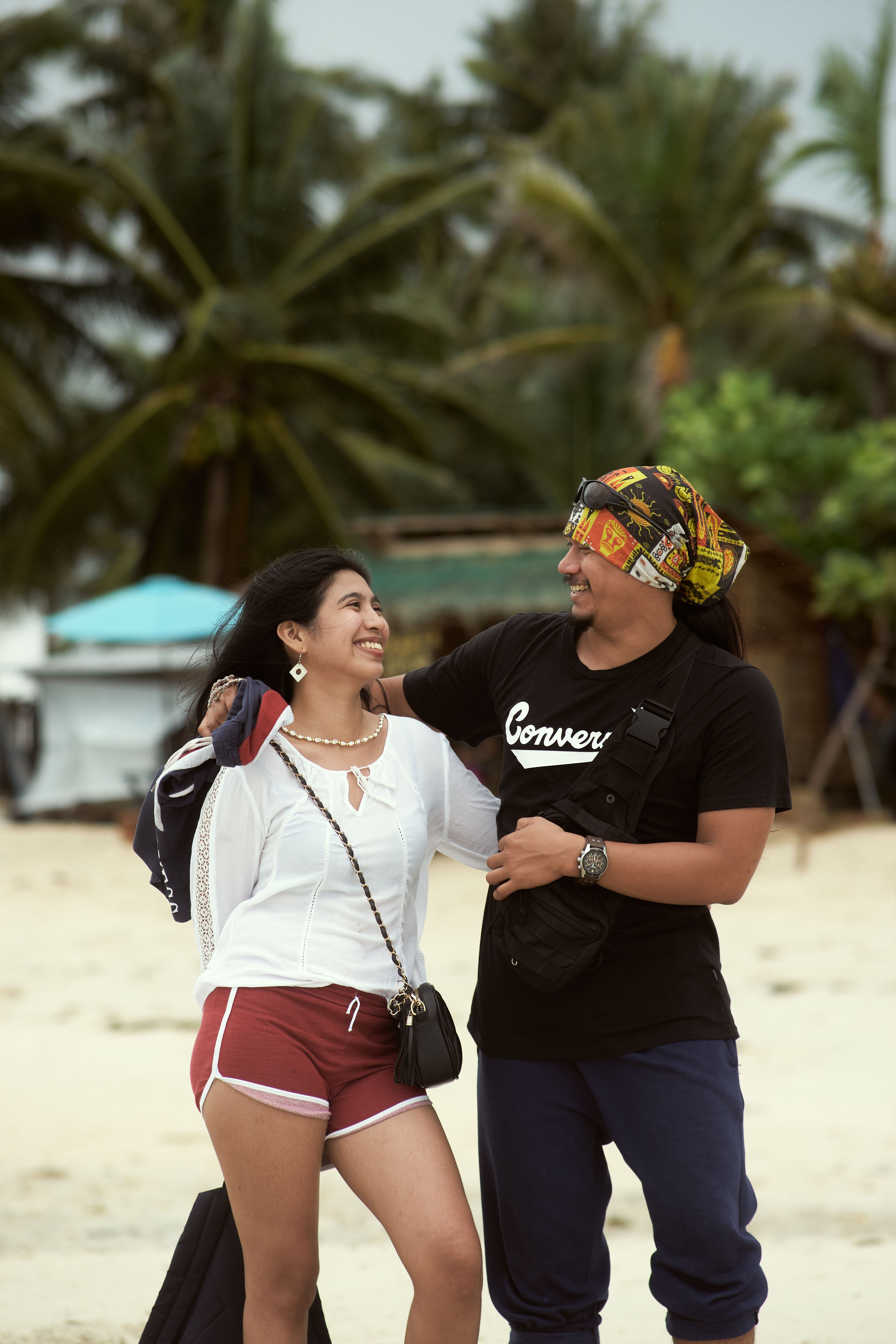 A Romantic Couple Standing on the Beach · Free Stock Photo