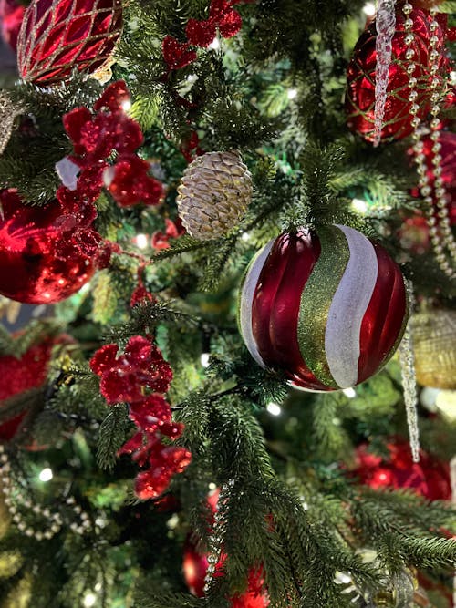 Red and Gold Baubles on Green Christmas Tree