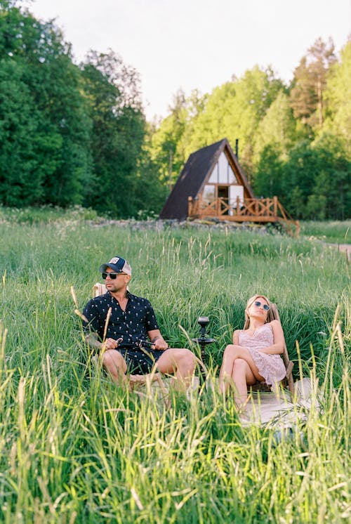 Free Couple Relaxing on a Meadow Stock Photo