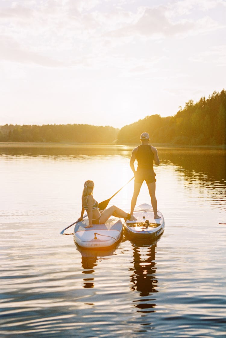 A Couple Kayaking On The Lake
