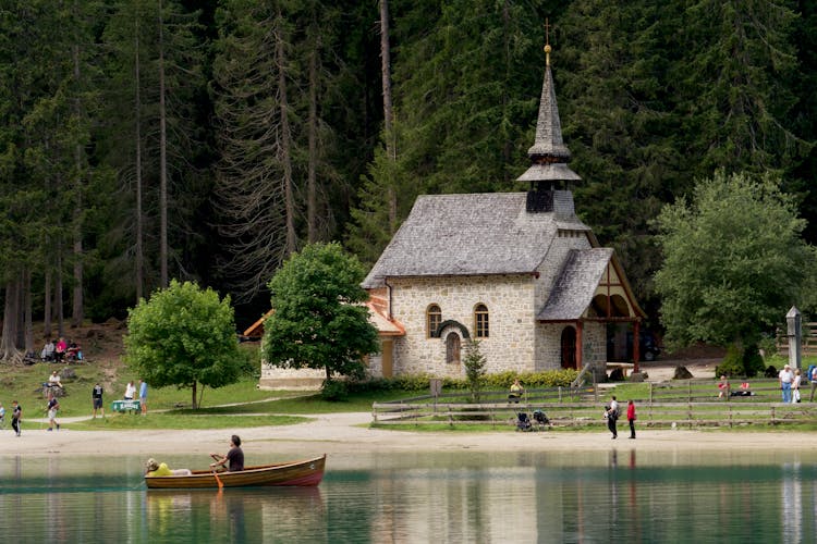 Old Stone Church Near Forest At River Bank