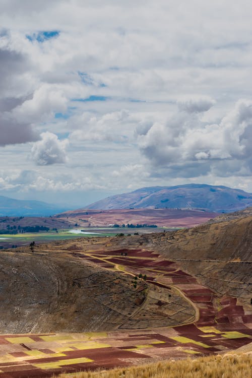 Brown Mountains Under White Clouds