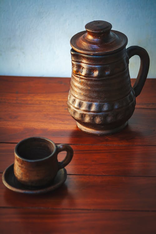 Free Brown Ceramic Teapot on Brown Wooden Table Stock Photo