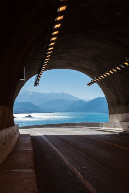 A breathtaking view of the lake and mountains from a tunnel in Mendoza, Argentina.
