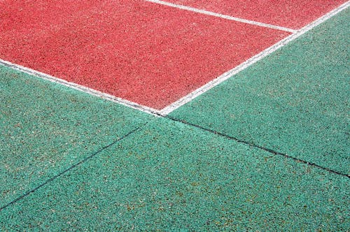 A Green and Red Outdoor Sports Court in Close-up Shot