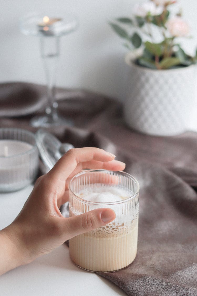 Hand Holding Glass With Coffee