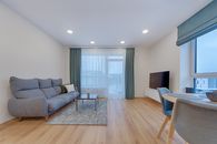 Gray Sofa Near White Window Curtain
