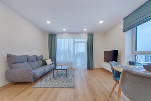 Cozy modern living room with a stylish sofa and elegant decor in Lithuania.