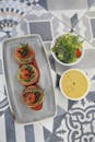 Sliced Tomato and Green Vegetable Salad on White Ceramic Bowl