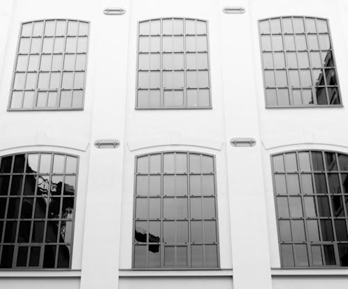 Free Glass Windows on a White Concrete Building Stock Photo