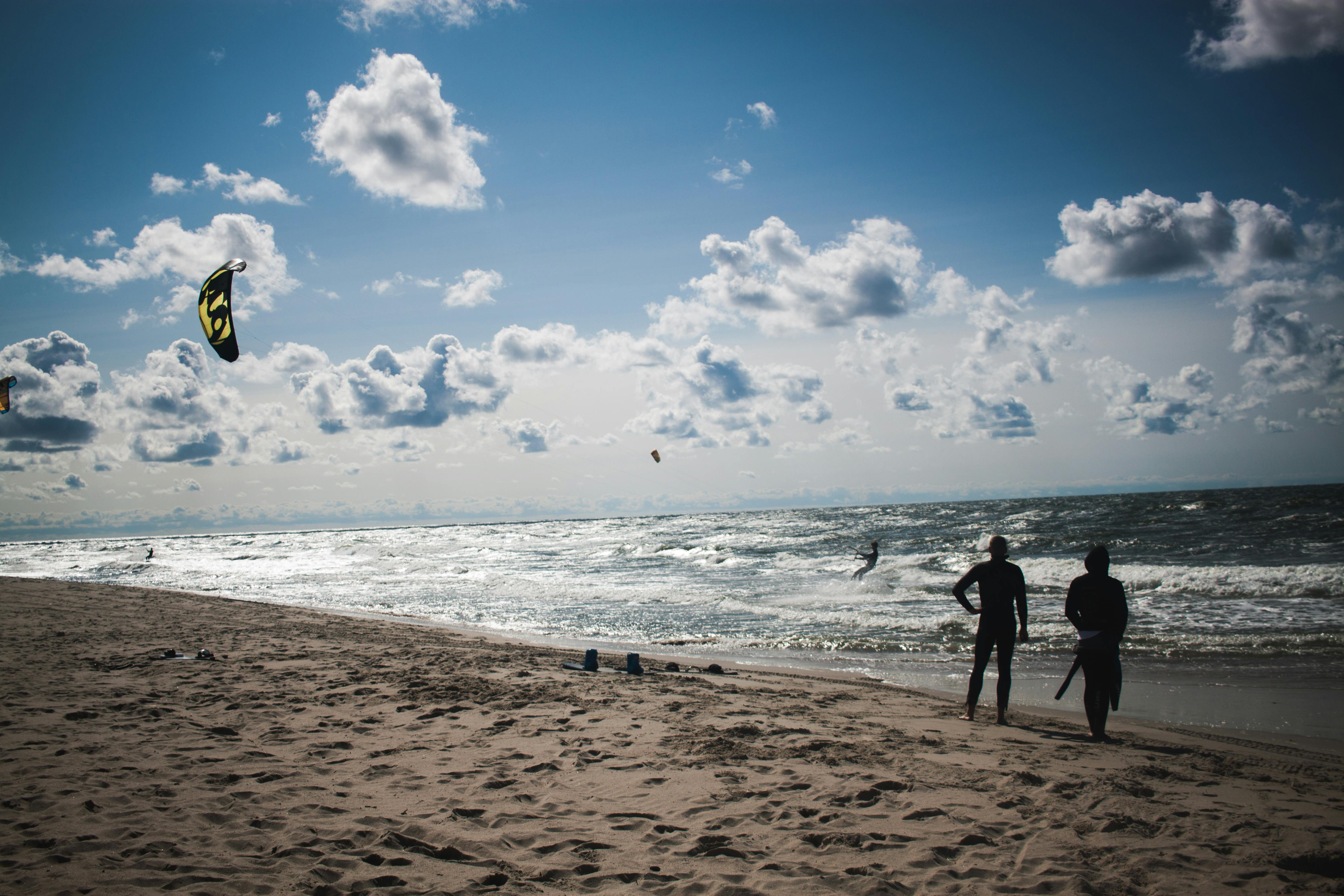 people standing at beach