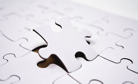 Detailed view of a single jigsaw puzzle piece being placed in a puzzle, symbolizing problem-solving.