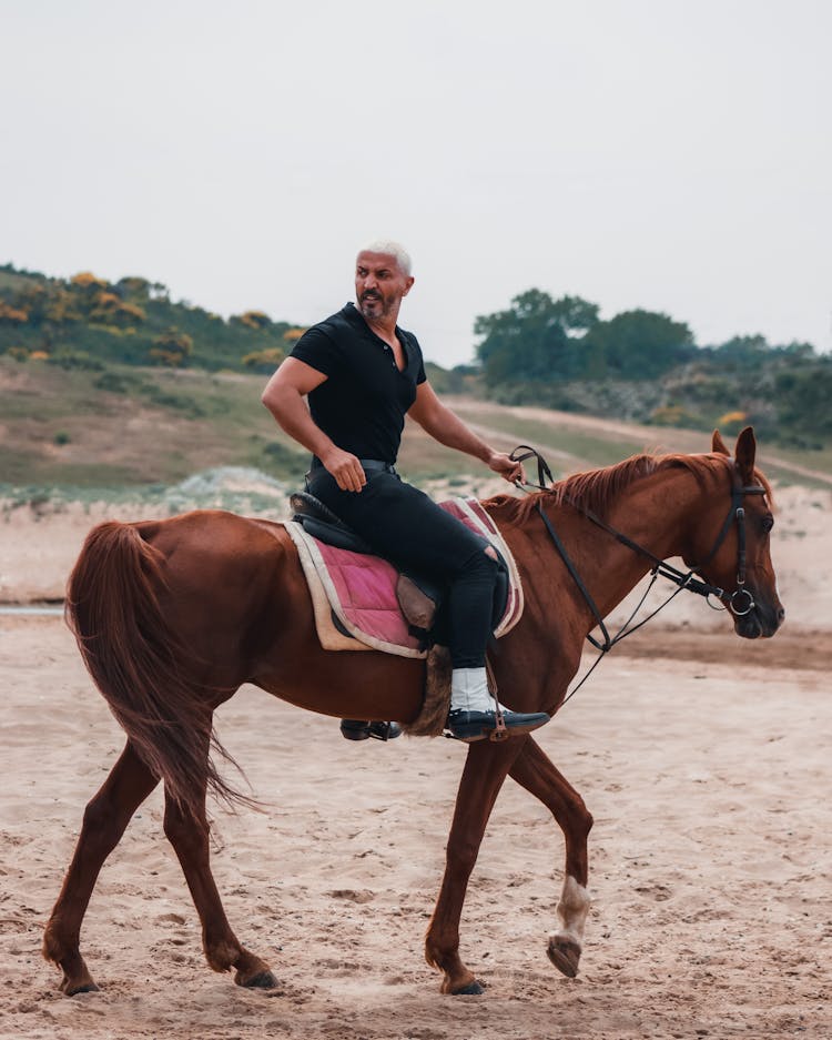 Man Riding Horse