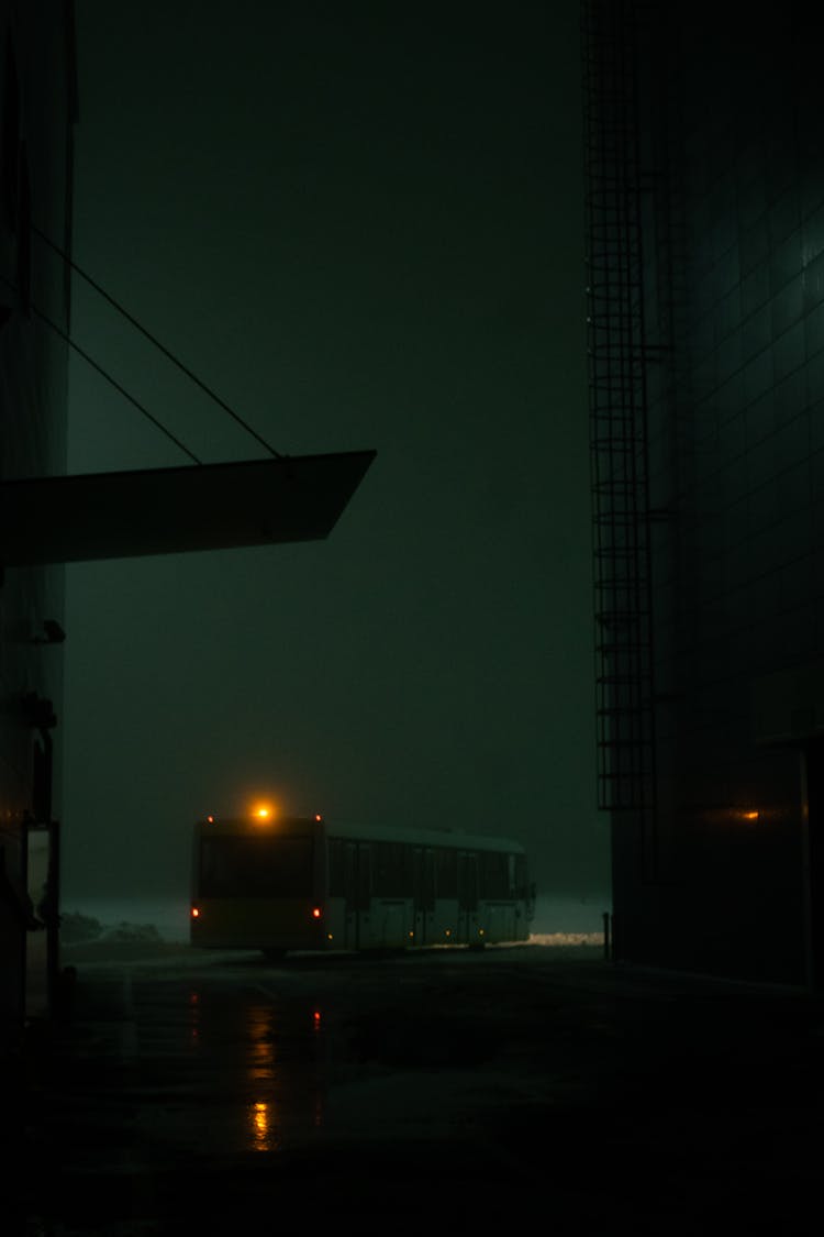 Bus On The Road At Night Time