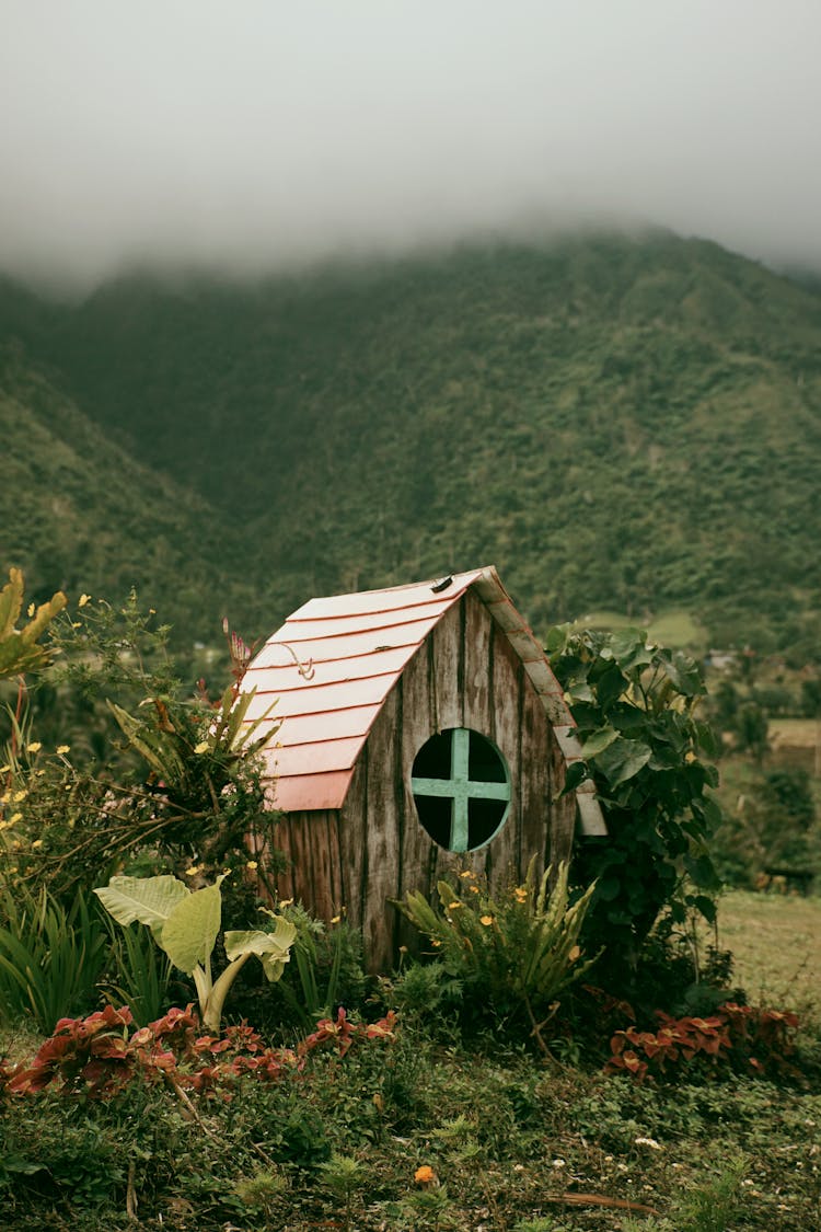 A Small Wooden House In The Garden