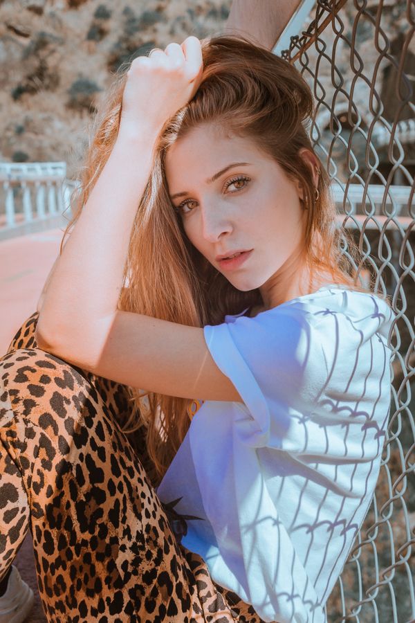Woman in a leopard print outfit with black jeans