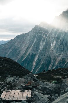 Majestic Canadian mountains with rocky terrain, captured during daylight with dramatic lighting.