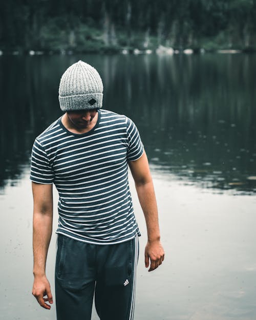 Man in Striped Shirt and Gray Beanie 
