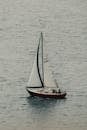 Red and White Sail Boat on Sea