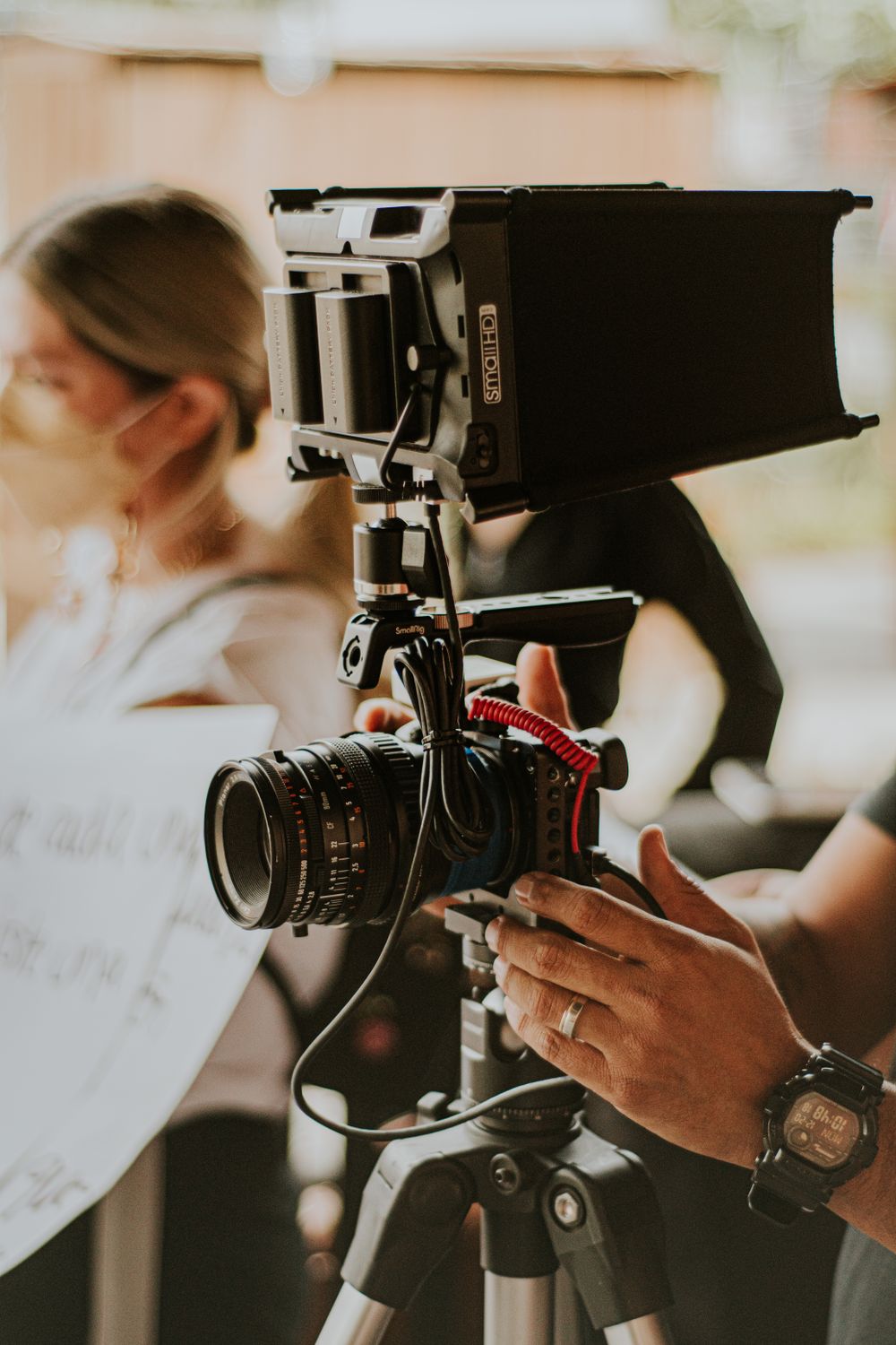 Filming Using Camera Person Filming with Professional Camera on Set · Free Stock Photo