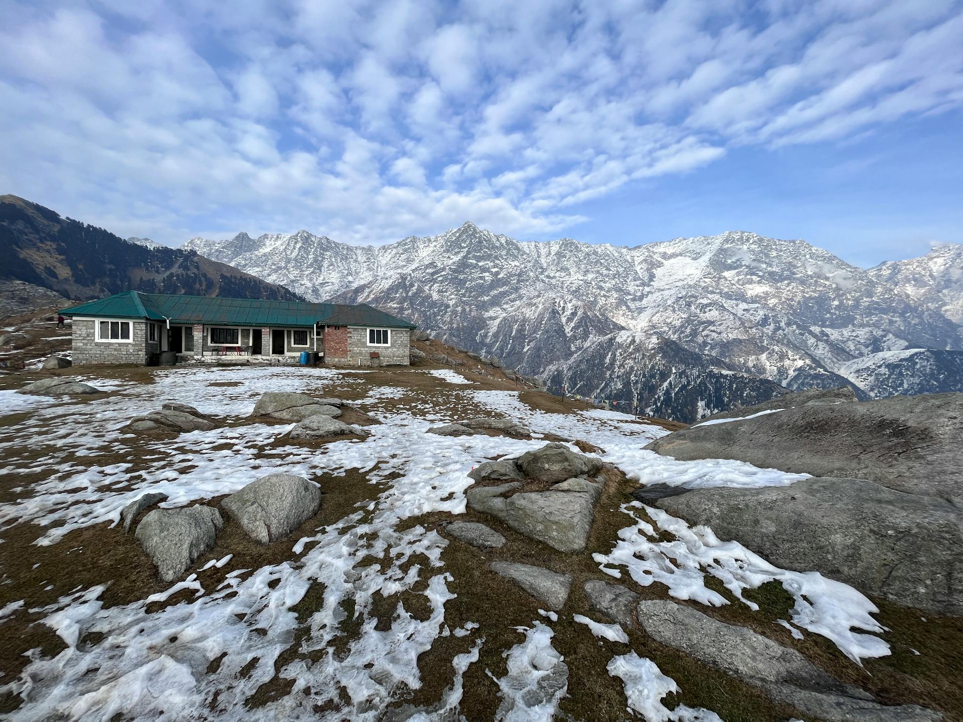 A Concrete House on Top of a Mountain with Snow