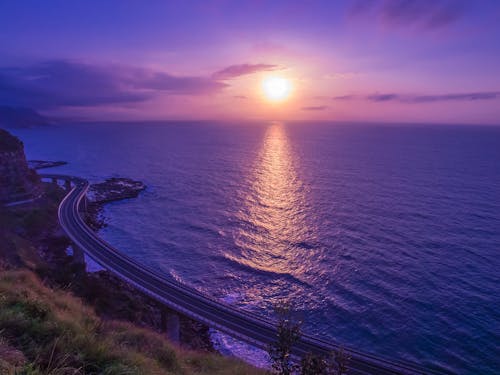 Free Body of Water Across Sunset Stock Photo