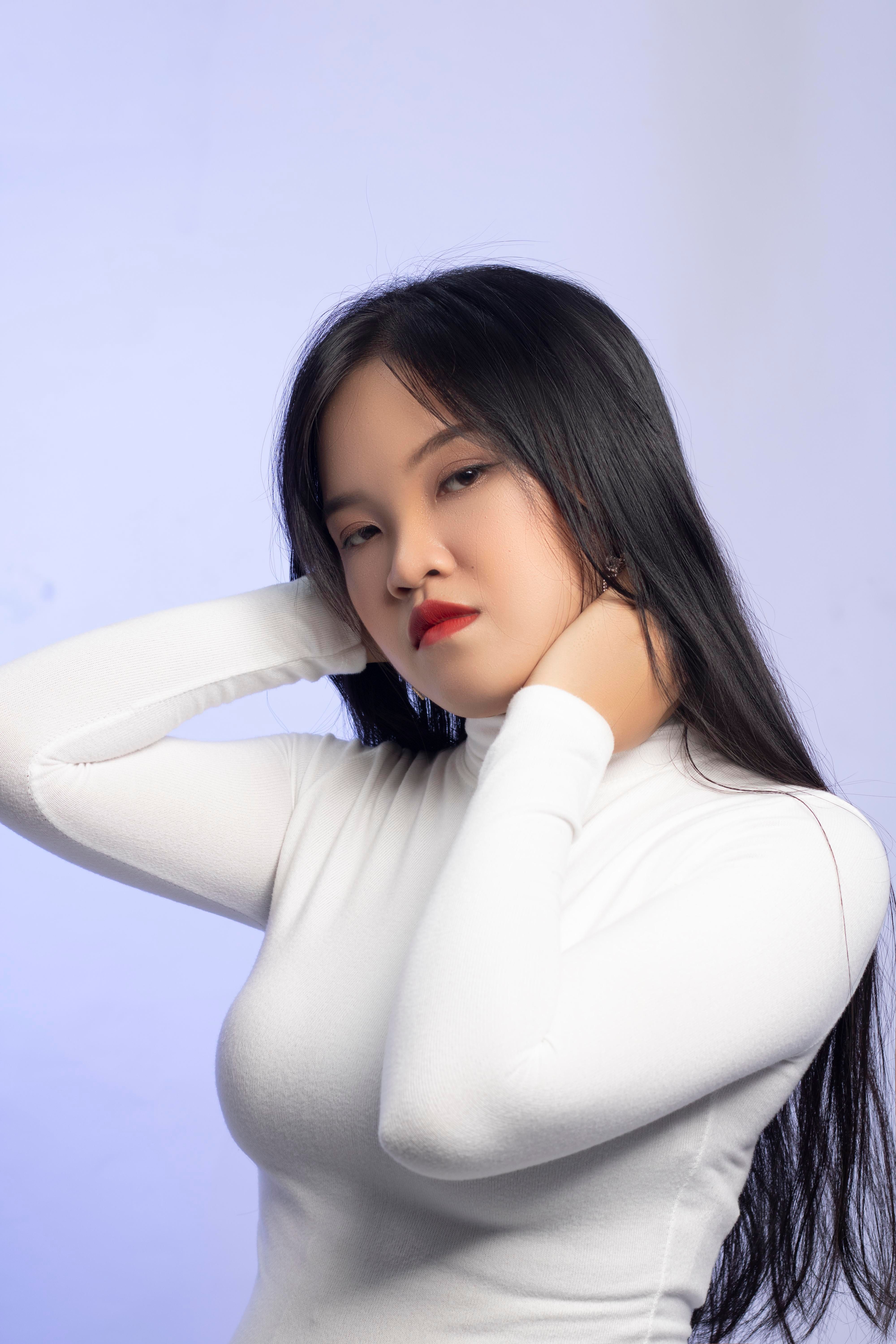 A Woman in White Long Sleeve Shirt · Free Stock Photo
