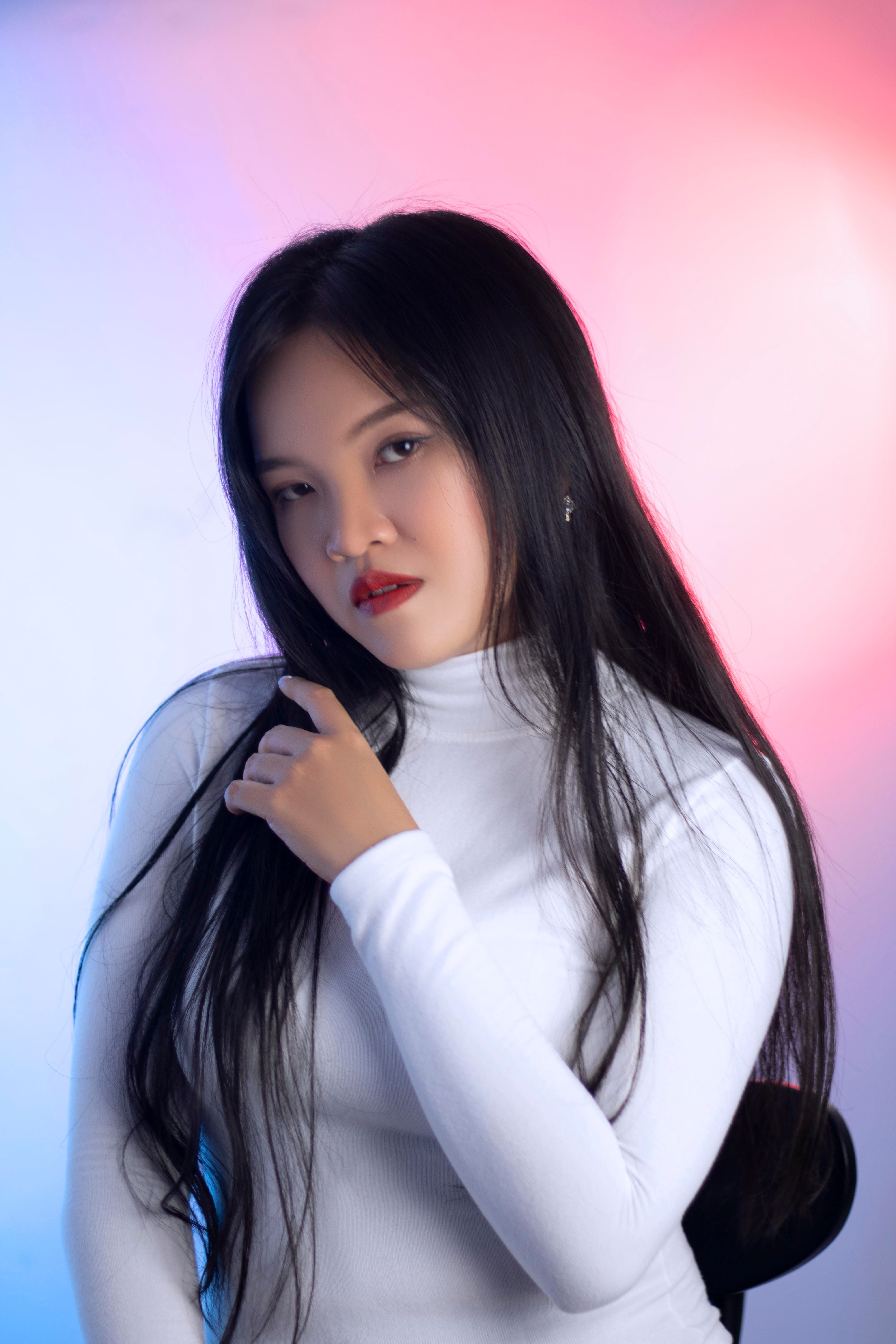 A Woman in White Long Sleeve Shirt · Free Stock Photo
