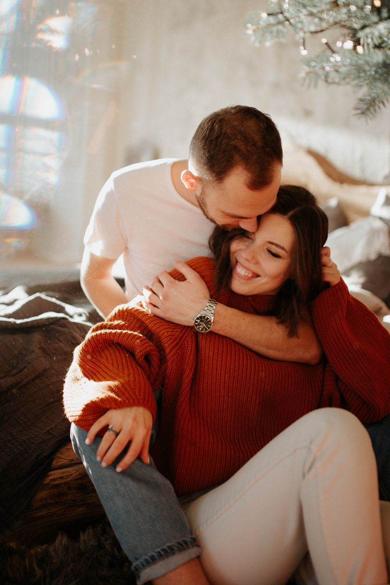 Couple sharing a warm hug at home, communication restored