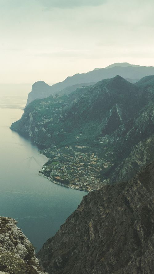 Free Breathtaking high angle view of Lake Garda surrounded by majestic mountains in Veneto, Italy. Stock Photo