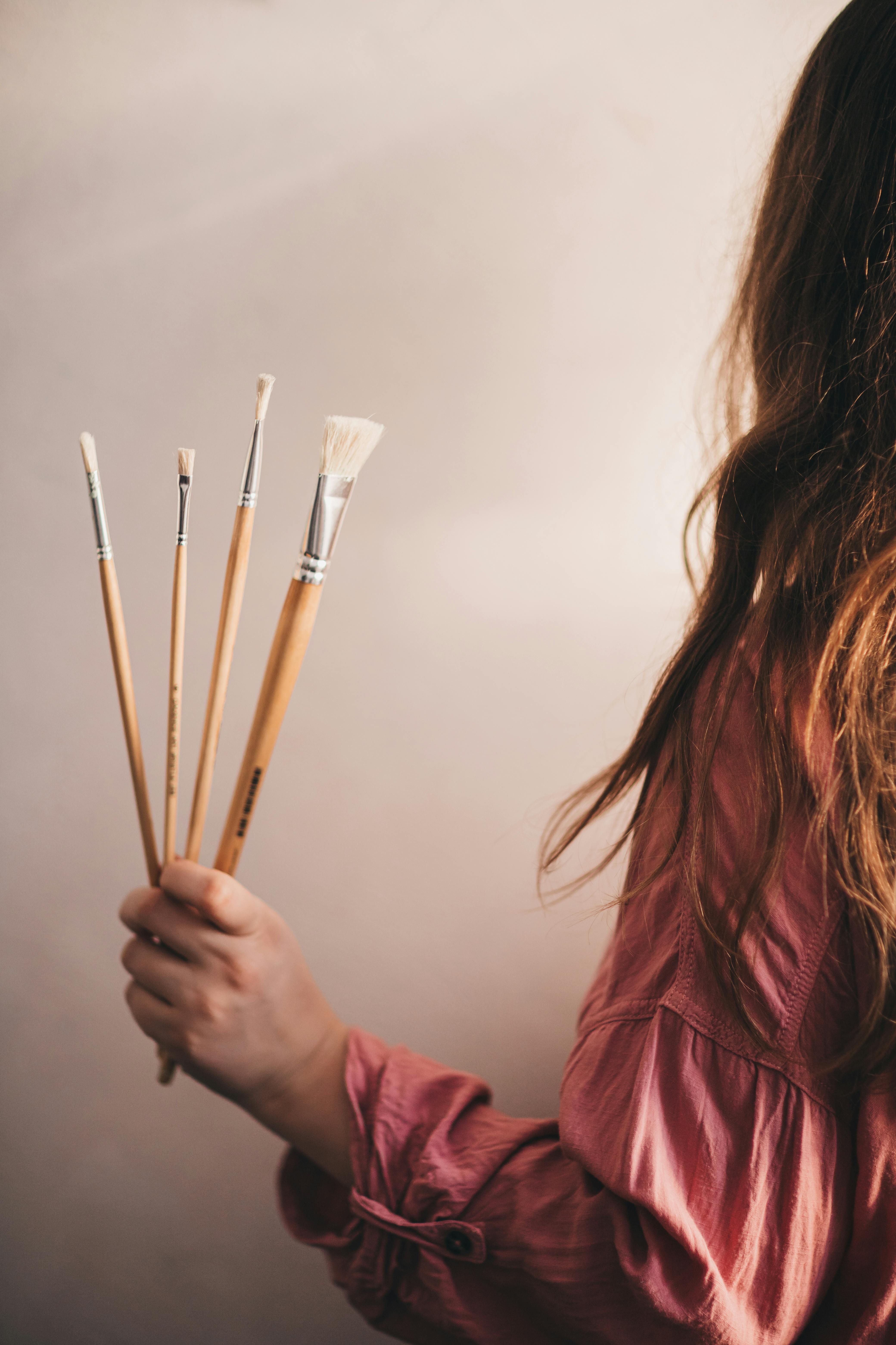 woman holding brushes