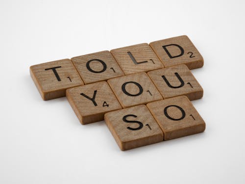 Brown Wooden Scrabble Tiles in Close Up Photography