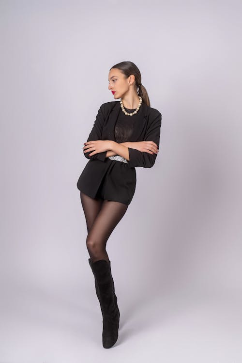Woman in Black Long Sleeve Shirt and Black Skirt