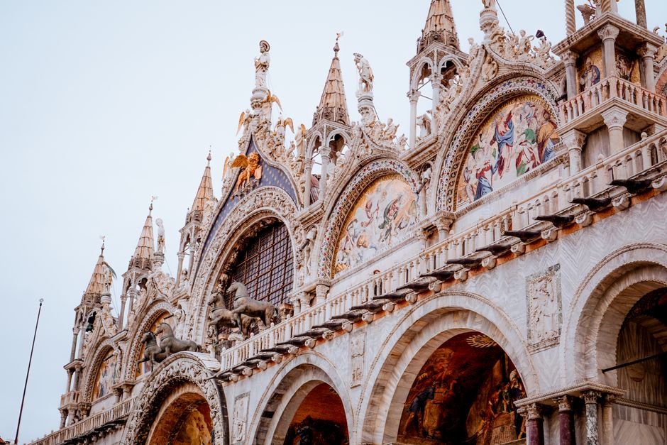 Captivating view of the ornate arches of St. Mark's Basilica, Venice's iconic landmark.