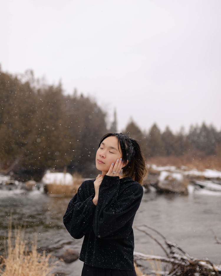 Woman Beside Lake In Winter 