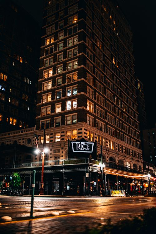 Free Stunning nighttime view of The Rice Building in downtown Houston, Texas, showcasing architecture. Stock Photo