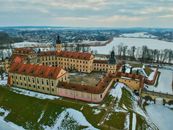 Drone shot of historic Niasviž Castle in Belarus, blanketed with snow.