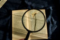 A Person Holding a Magnifying Glass