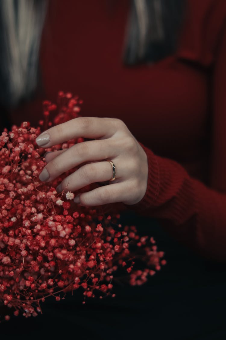 Hand Touching Flowers