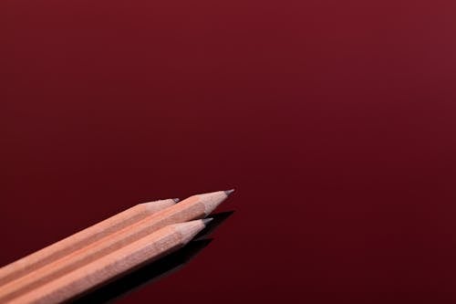 Sharp Pencils on a Red Surface 