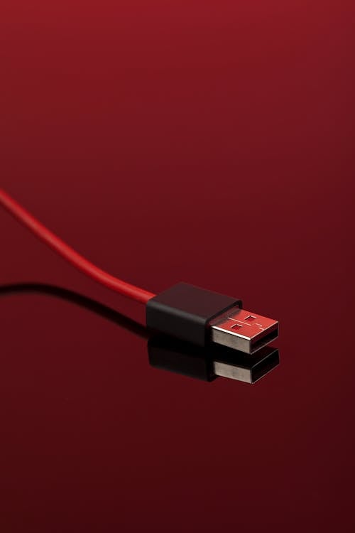 Red USB Cable on Red Background