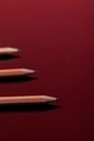 Brown Pencil on Red Background
