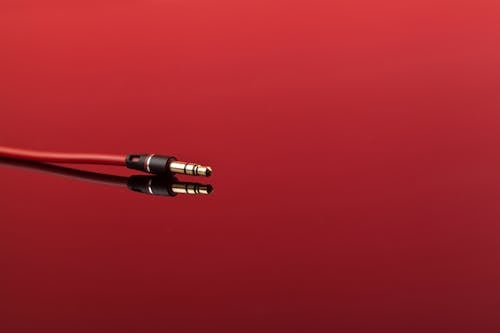 Free Cable Jack on Red Surface  Stock Photo