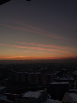A stunning aerial view of Van city during sunset with a dramatic sky.