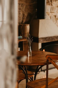 Warm and inviting rustic living room featuring a rustic table and cozy fireplace.