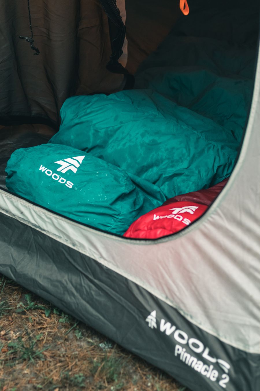 Two colorful sleeping bags inside a tent on a camping trip in Canada. Stock Photo