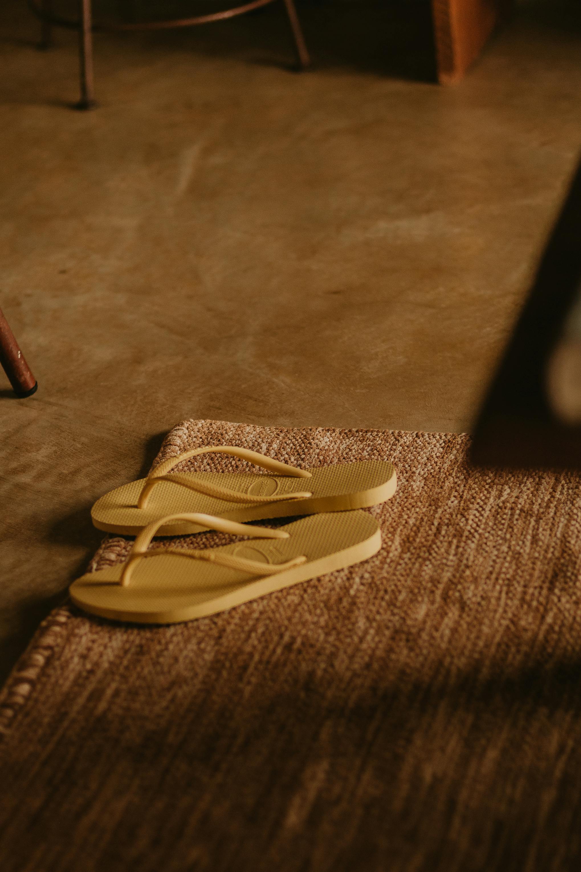 Flip Flops Slippers on a Mat · Free Stock Photo